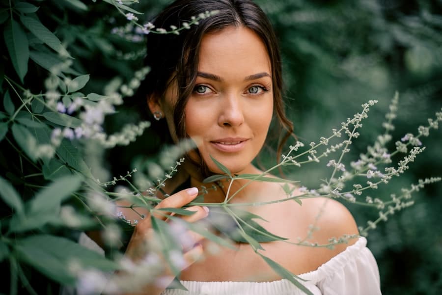 A woman with brown hair among green foliage. Stock photograph, not taken at any listed clinic.