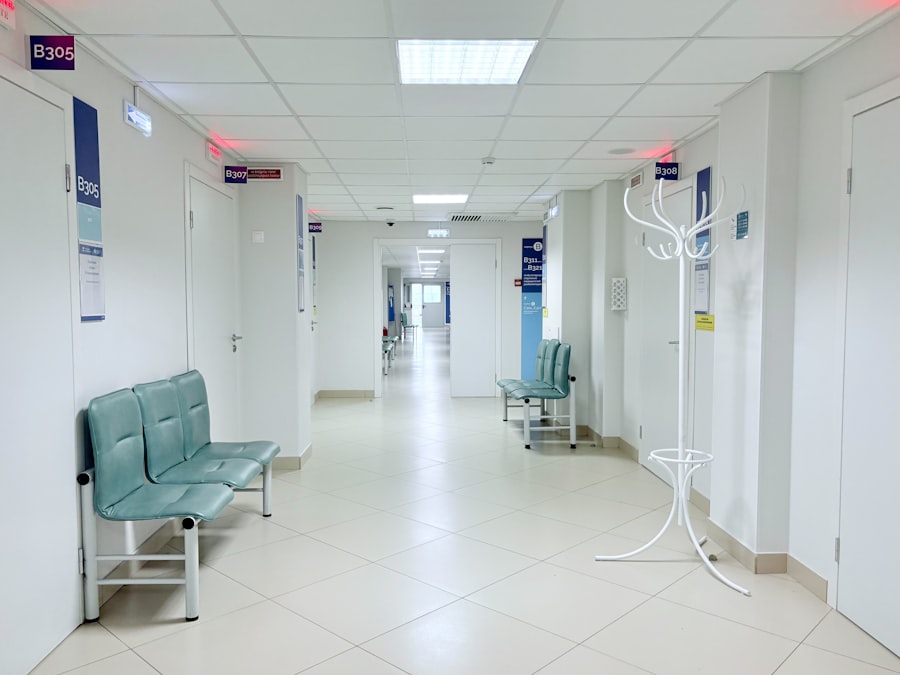 Empty hospital corridor with benches and doors. Stock photograph, not taken at any listed clinic.